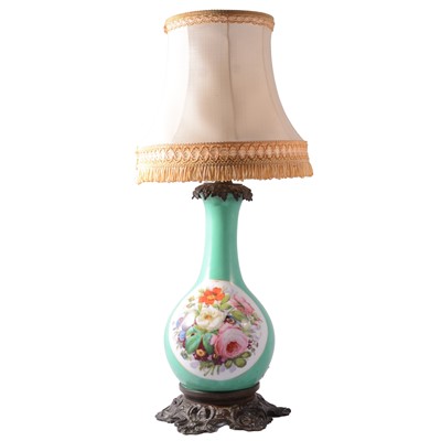 Lot 24 - A porcelain table lamp with cast metal base and collar.