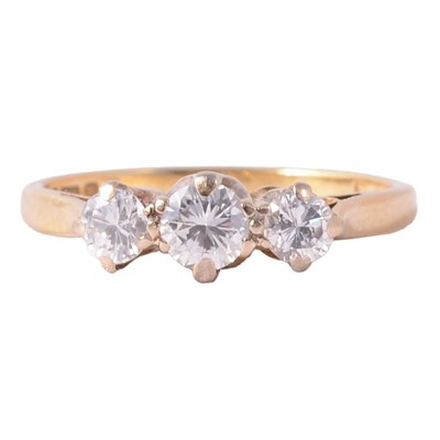 Lot 74 - A diamond three stone ring.