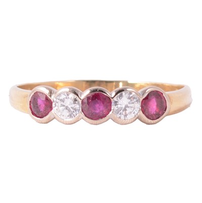 Lot 40 - A ruby and diamond five stone ring.