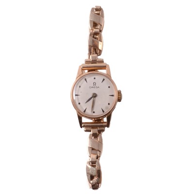 Lot 428 - Omega - a lady's yellow metal manual wind bracelet wristwatch.