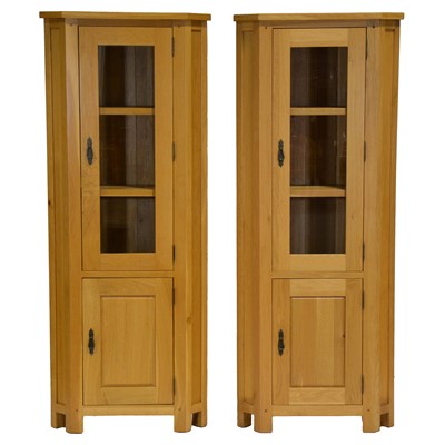 Lot 348 - Pair of contemporary light oak freestanding corner cabinets