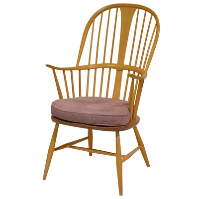 Lot 396 - Ercol, elm and beech single highback armchair, and associated footstool