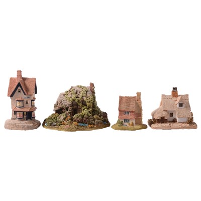 Lot 28 - Thirty-three Lilliput Lane cottages, champagne glasses, fridge magnets, and pocket guides.