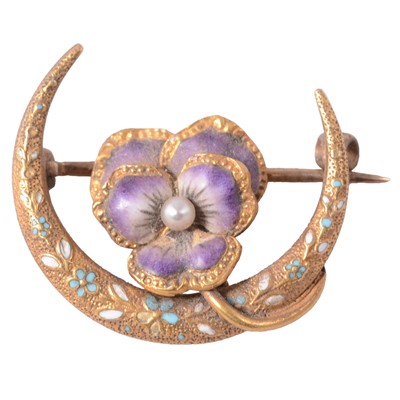 Lot 212 - A yellow metal and enamel pansy and crescent moon brooch.