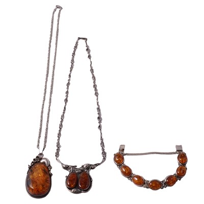 Lot 335 - Heat treated amber bracelet, necklace, and pendant on a chain.