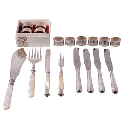 Lot 310 - Set of six Peruvian white metal napkin rings, mother-of-pearl handled flatware, and other plated cutlery.