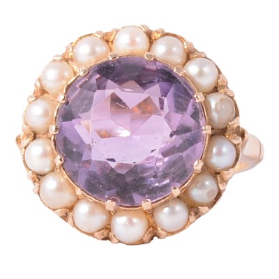 Lot 108 - An amethyst and pearl cluster ring.