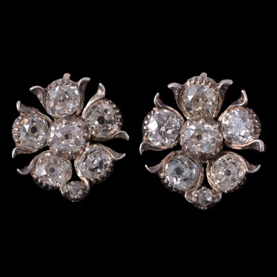 Lot 175 - A pair of diamond cluster earrings.