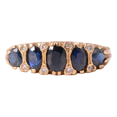 Lot 17 - A sapphire half hoop ring.