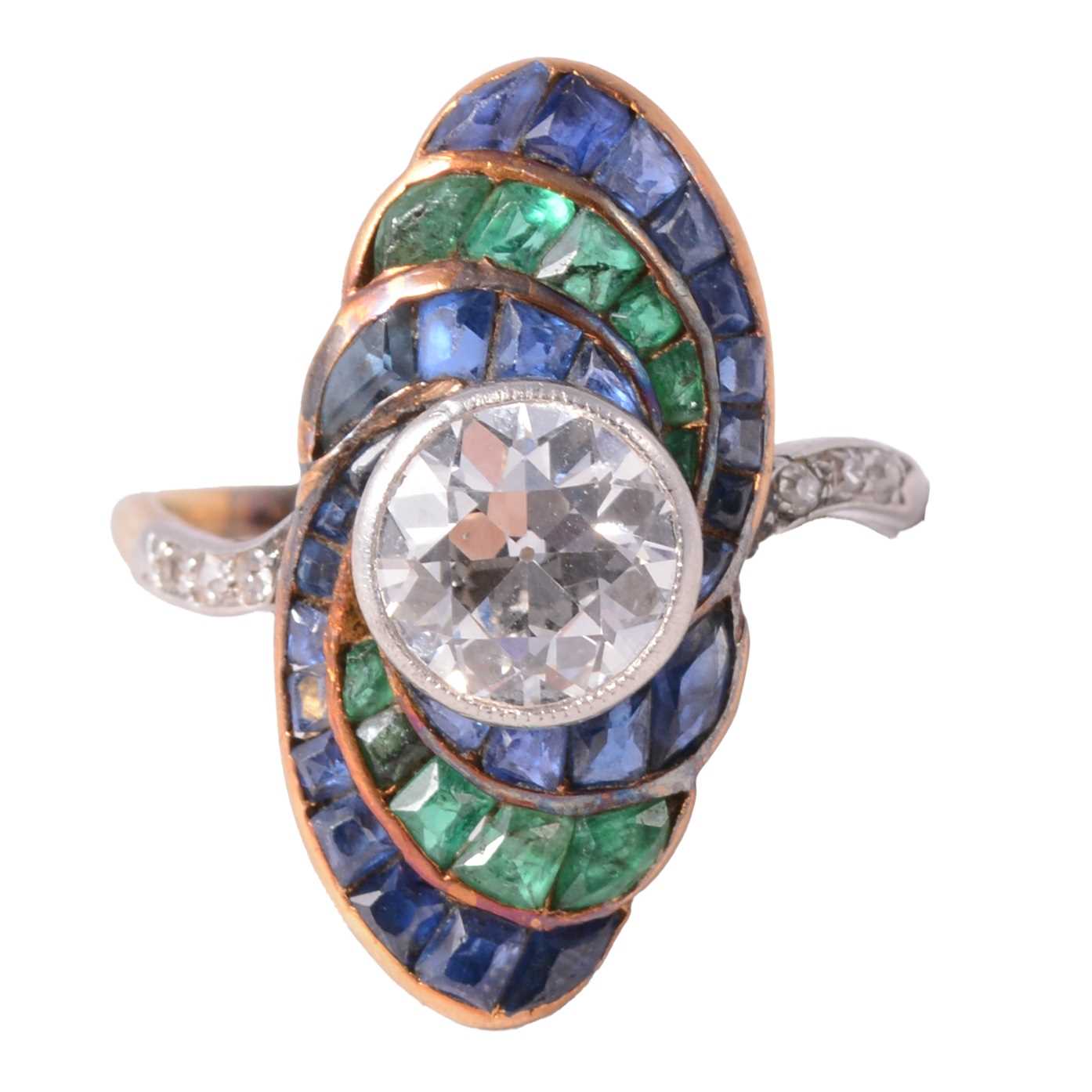 Lot 20 - An Art Deco diamond ring with emerald and sapphire surround.