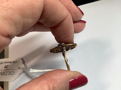 Lot 20 - An Art Deco diamond ring with emerald and sapphire surround.