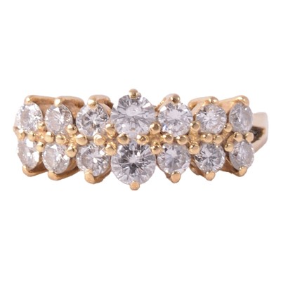 Lot 99 - A diamond two row half hoop ring.