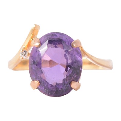 Lot 109 - An amethyst and small diamond dress ring.