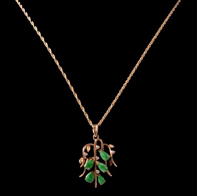 Lot 252 - A jade and diamond pendant on a chain, and matching earrings.