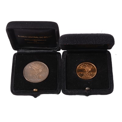 Lot 319 - Brazil - A gold 300 cruzeiros coin and a silver 20 cruzeiros coin.