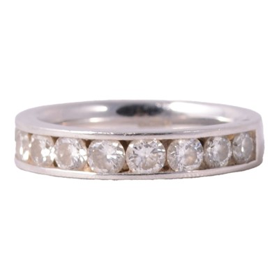 Lot 103 - A diamond half eternity ring.