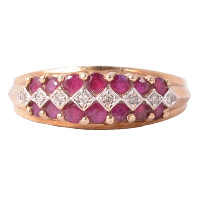 Lot 36 - A ruby and diamond half hoop ring.