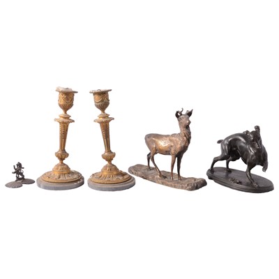 Lot 153 - After Mene, a patinated spelter whippet group, gilt deer sculpture, and apair of candelsticks