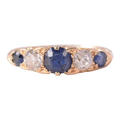 Lot 14 - A sapphire and diamond half hoop ring.