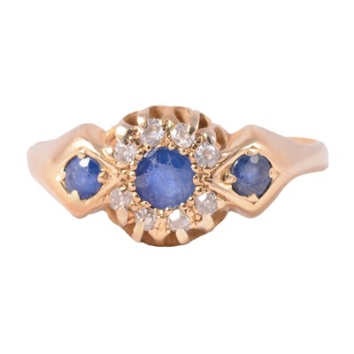 Lot 12 - A sapphire and diamond cluster ring.