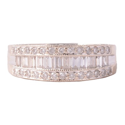 Lot 98 - A modern diamond half hoop ring.