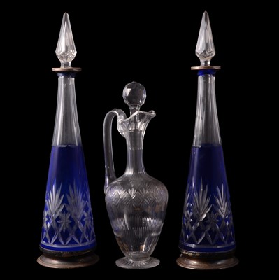 Lot 22 - Pair of blue overlaid cut glass decanters and a claret jug