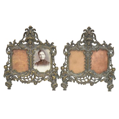 Lot 212 - Pair of Victorian cast brass twin-photograph frames, and a cast brass kettle stand