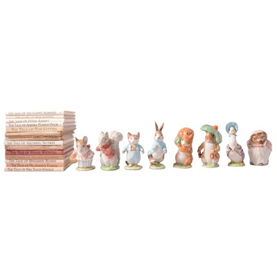 Lot 166 - Beatrix Potter - fourteen books and a collection of eight Beswick figures