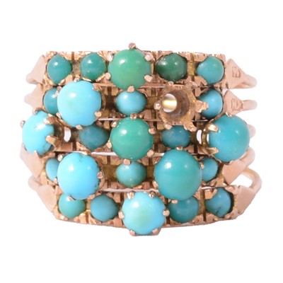 Lot 123 - A five strand yellow metal ring set with turquoise.
