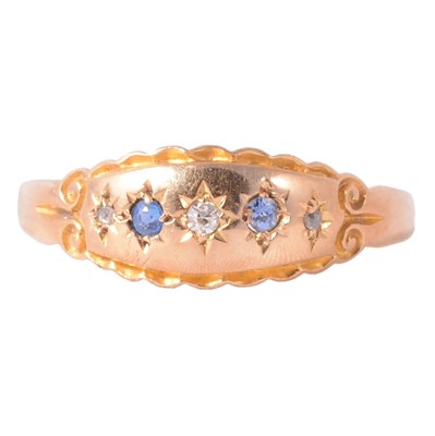 Lot 148 - A 15 carat yellow gold ring set with sapphires and diamonds.