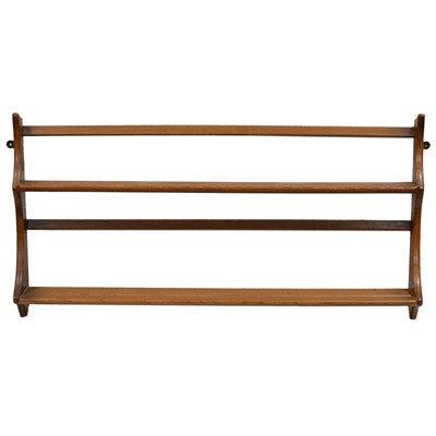Lot 179 - Two elm open wall racks, by Ercol