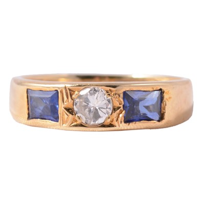 Lot 3 - A sapphire and diamond three stone ring.