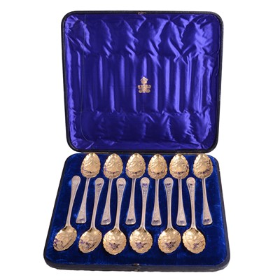 Lot 104 - Set of twelve silver and gilt berry spoons