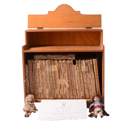 Lot 160 - Beatrix Potter books, bookcase and two small dolls