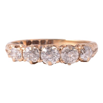 Lot 79 - A diamond five stone ring.