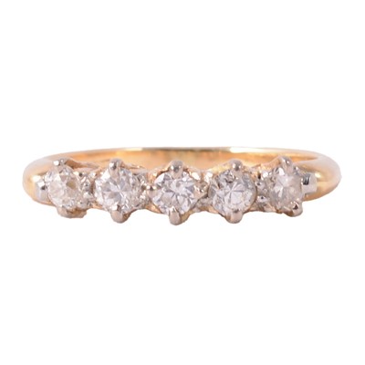 Lot 81 - A diamond five stone ring.