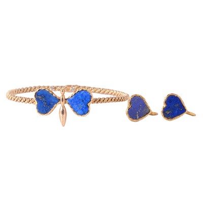 Lot 280 - A 1970's vintage lapis lazuli bangle, and matching earscrews.