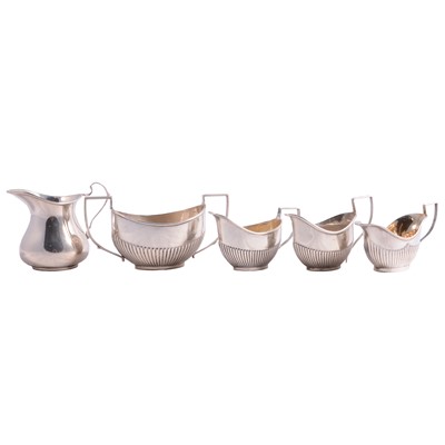 Lot 182 - Silver sugar bowl and four silver milk jugs