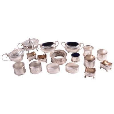 Lot 201 - Seven silver napkin rings and silver condiments