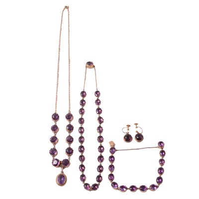 Lot 261 - Two amethystand prple stone necklaces, bracelet and purple paste earscrews.