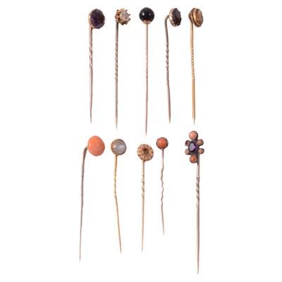 Lot 349 - Eight solitaire stick pins, and two cluster stick pins.