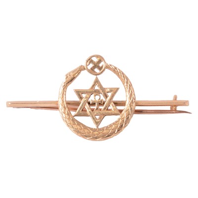 Lot 221 - An unmarked yellow metal Theosophical Society bar brooch.