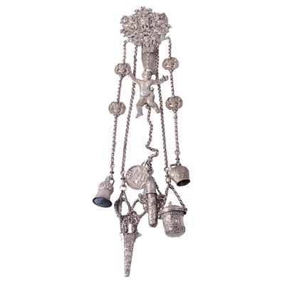 Lot 479 - A continental white metal chatelaine with silver and white metal attachments.