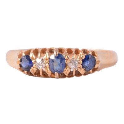 Lot 16 - A sapphire and diamond half hoop ring.