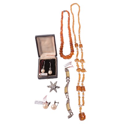 Lot 529 - A Victorian paste set star brooch, necklace, amber-coloured bead necklaces, and other jewellery.