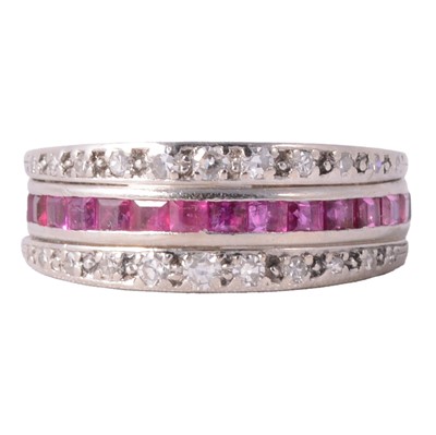 Lot 43 - A sapphire, ruby and diamond night and day eternity ring.