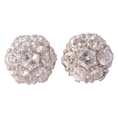 Lot 174 - A pair of diamond cluster earrings.