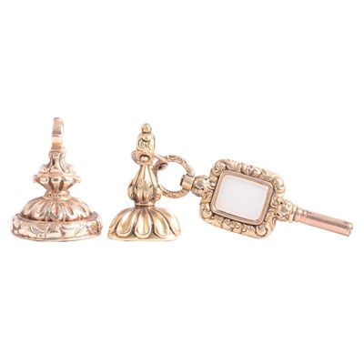 Lot 361 - Two antique yellow metal seals with intaglio carved bases, and a watch key.