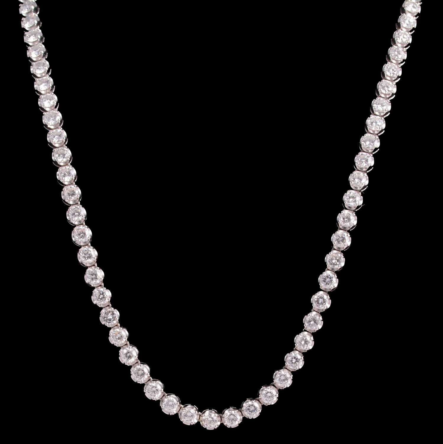 Lot 264 - A diamond riviere necklace.