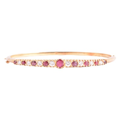 Lot 276 - A ruby and diamond bangle in the Victorian style.